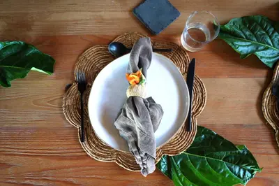 a plate of food on a table with a napkin at The Aerial, BVI in Tortola Island