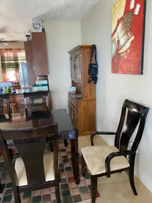 a dining room with a table and chairs at Top of the Hill Blue Sunshine in Long Swamp