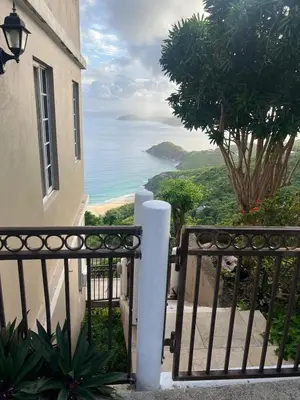 a view of the ocean from a balcony of a building at SummervilleBVI in Great Mountain