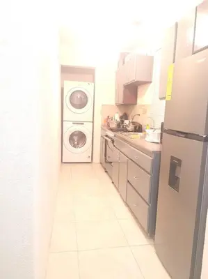 a kitchen with a refrigerator and a washer and dryer at Sage Mountain Skyway, Comfortable One Bedroom in Sage Mountain, Tortola in Great Carrot Bay