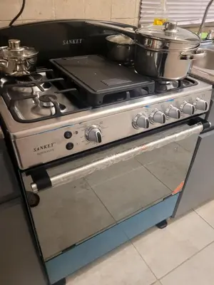 a stove with pots and pans on top of it at Sage Mountain Skyway, Comfortable One Bedroom in Sage Mountain, Tortola in Great Carrot Bay