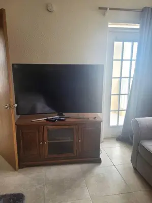a large flat screen tv in a living room at Sage Mountain Skyway, Comfortable One Bedroom in Sage Mountain, Tortola in Great Carrot Bay