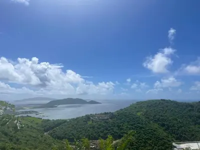 a view of a large body of water with trees at Ocean Breeze Comfort in East End