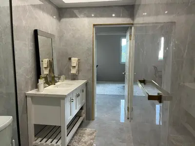a bathroom with a sink and a mirror at Exquisitely Threadfall in Cane Garden Bay