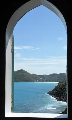 a view of the ocean from a window at Lowena Cottage in Tortola Island