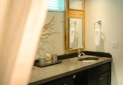 a bathroom with a sink and a mirror at Endless Summer Villa in Tortola Island