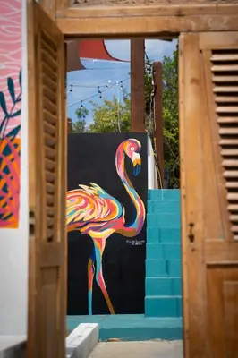 a colorful flamingo painted on the side of a building at Villa Odyssea BVI in Tortola Island