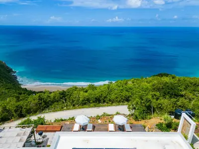 an aerial view of the ocean from a resort at Villa Odyssea BVI in Tortola Island