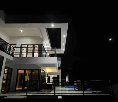 a view of a building at night with a balcony at Villa Modere' in Tortola Island