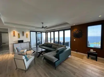 a living room with a couch and a table at Villa Modere' in Tortola Island