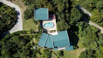 an aerial view of a house with a pool on it at Tamarind Villa in Virgin Gorda
