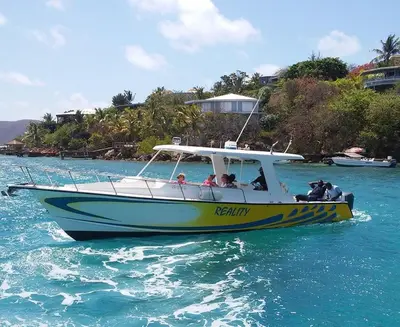 a group of people riding a boat in the water at Tamarind Villa in Virgin Gorda