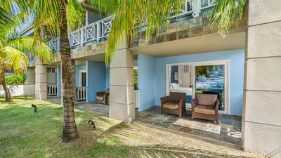 a view of the front of a house with palm trees at Moorings Yacht Club in Road Town