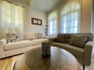 a living room with a couch and a table at Abigail's Esmeralda 2 bedrom Apt in Tortola Island