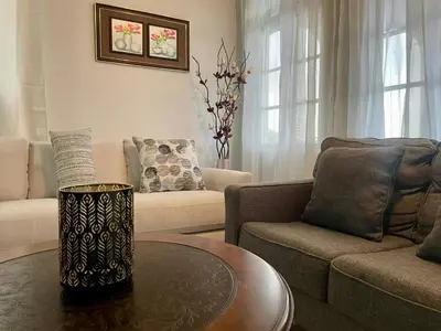 a living room with a couch and a table at Abigail's Esmeralda 2 bedrom Apt in Tortola Island