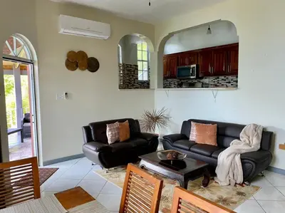 a living room with a couch and a table at Tranquil Escape at Ballast Bay in Road Town