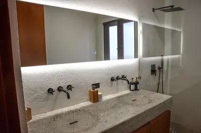 a bathroom with a sink and a mirror at Odyssea Oasis in Tortola Island