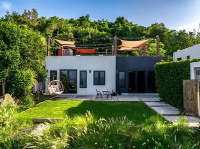a view of a house with a yard at Odyssea Oasis in Tortola Island