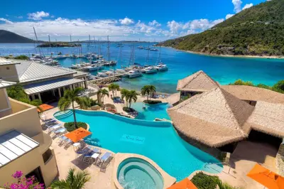 an aerial view of a resort with a marina at Scrub Island Resort, Spa & Marina in The Mill