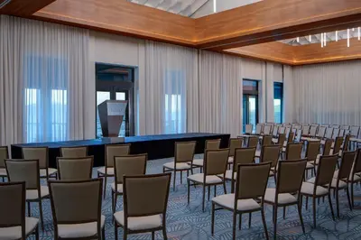 a room with a bunch of chairs and a table at Peter Island Resort in Anderson