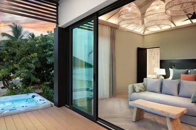 a living room with a couch and a table at Peter Island Resort in Anderson