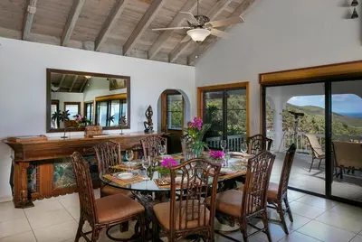 a dining room with a table and chairs at TAMAR VILLA in Virgin Gorda
