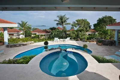 a swimming pool in the middle of a resort at BLUE LAGOON in Virgin Gorda
