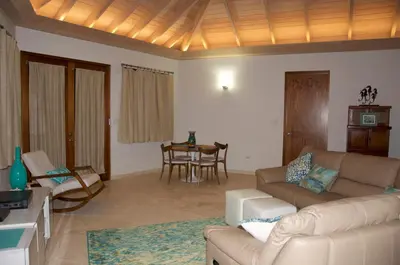 a living room with a couch and a table at CARIBBEAN WIND in Virgin Gorda