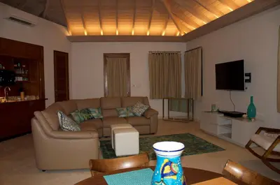 a living room with a couch and a table at CARIBBEAN WIND in Virgin Gorda