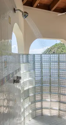 a shower in a bathroom with a window at LOBLOLLY in Virgin Gorda