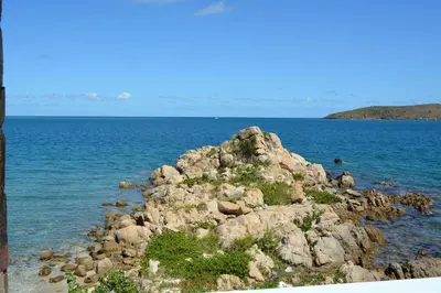 a pile of rocks in the middle of the ocean at SERENDIPITY in Virgin Gorda