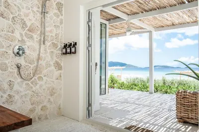 a bathroom with a view of the ocean at Long Bay Beach Resort in Tortola Island