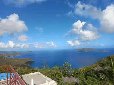 a view of the ocean from a house at More Than Beauty Properties in Tortola Island