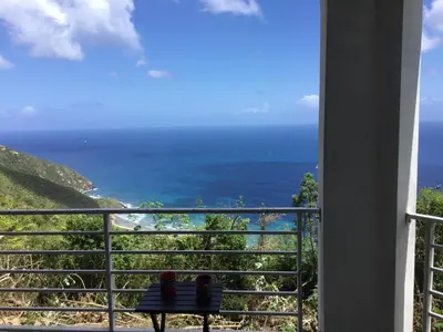 a view of the ocean from a balcony at Abigail's Spectacular 2 bedrooms-Entire Apartment in Tortola Island