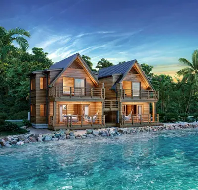 a log house on the water in front of the ocean at Bitter End Yacht Club in Virgin Gorda