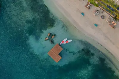 an aerial view of a beach with a paddle board at Bitter End Yacht Club in Virgin Gorda